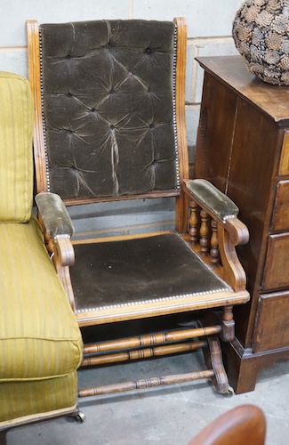 An early 20th century American upholstered mahogany rocking chair, width 58cm, depth 52cm, height 102cm